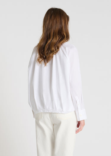 Détail chemise Seneçon blanc optique zip frontal col chemise poignets nacre popeline