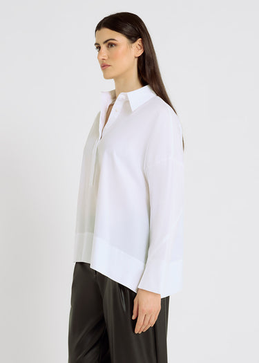 Chemise blanche femme chic, volume oversize, fente poignet, découpe dos – Simone
