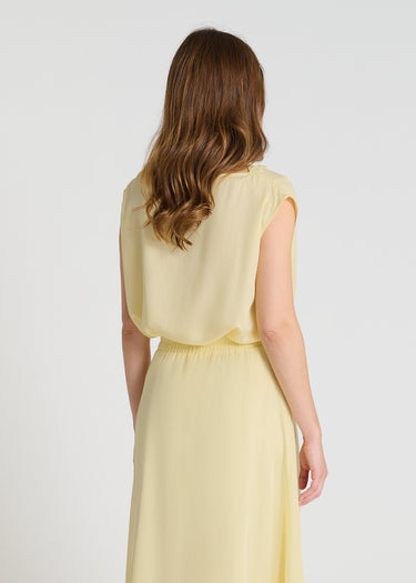 Vue arrière jupe Tulipe jaune Tencel longueur midi mouvement léger silhouette féminine