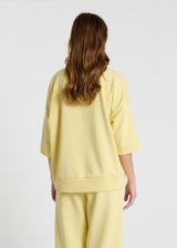 Sweat jaune femme oversize – col V bord-côte, molleton confortable, look casual chic tendance