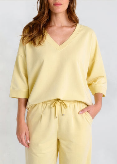 Sweat molleton jaune femme col V – coupe oversize structurée, bord-côte encolure et bas, silhouette décontractée