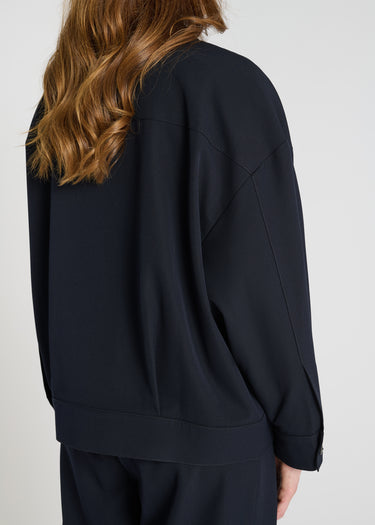 Vue arrière blouson Poppy bleu marine veste femme tailleur plis dos structure raffinée
